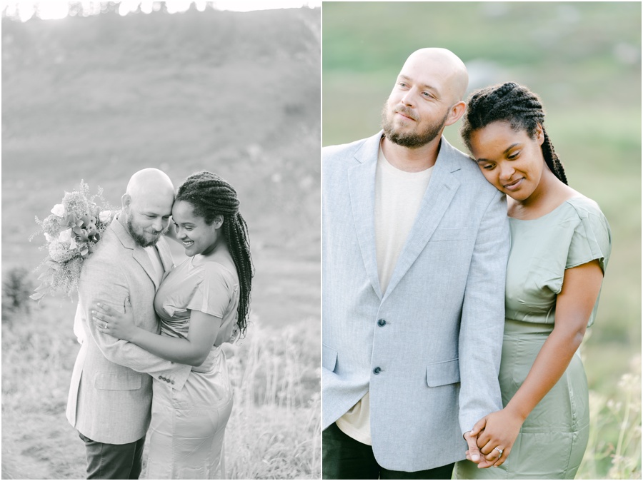 Couple touching heads and looking down, holding hands at their engagement session in Seattle.